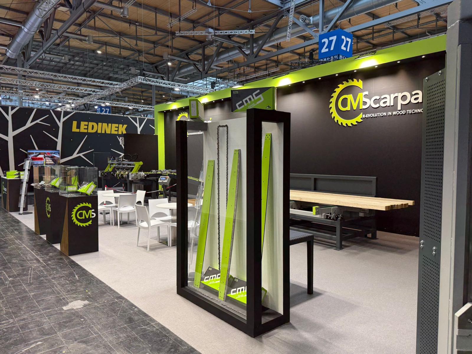 Vertical display with CMS blades and components at the entrance to the stand